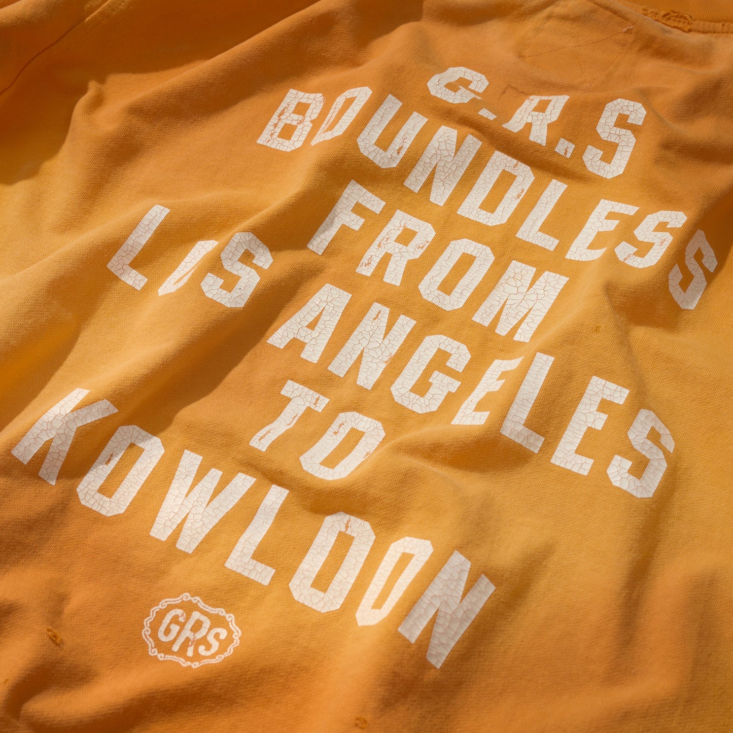 SUN FADED HAND STENCIL WASHED “KOWLOON” TEE / SIGNAL ORANGE